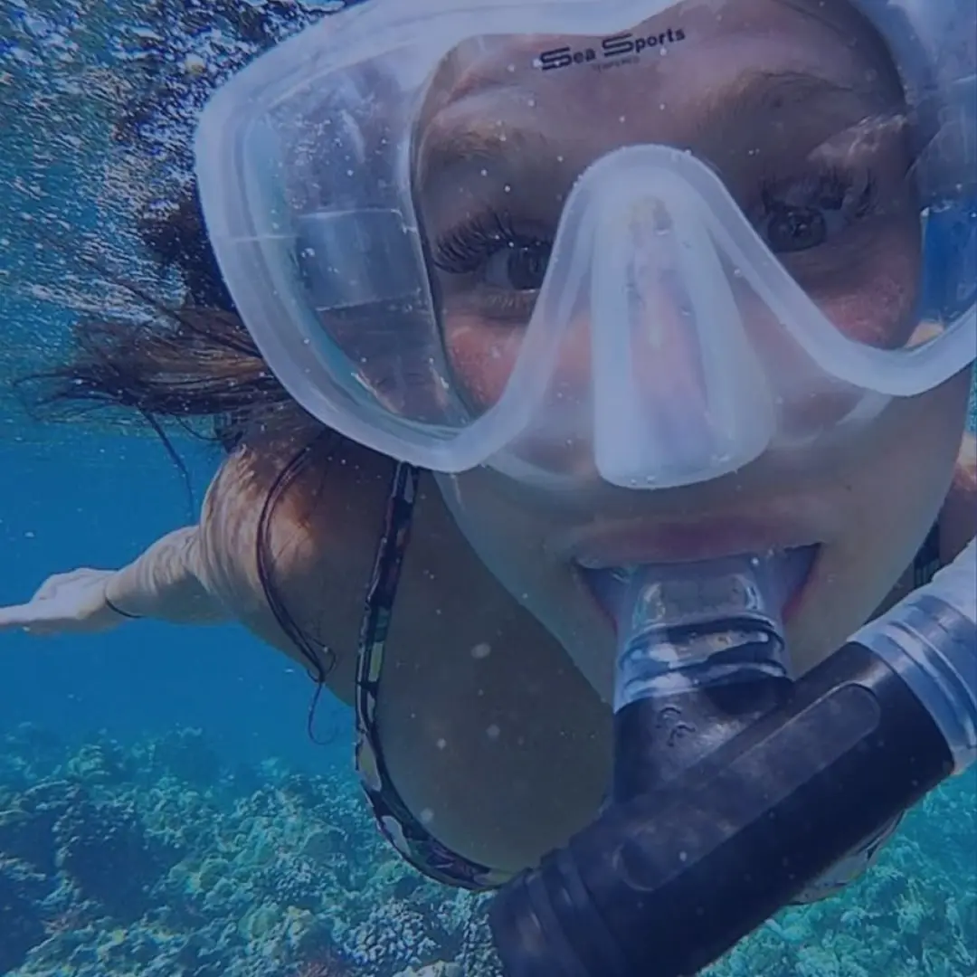 Snorkeler enjoying an underwater adventure above a vibrant coral reef